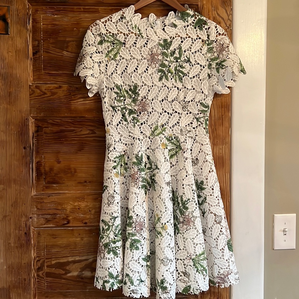 Chicwish White Floral Dress w/Cut Out Details. Size S. Needs slip underneath.